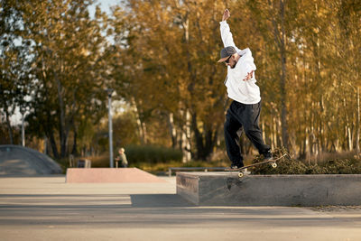 Man skateboarding at park