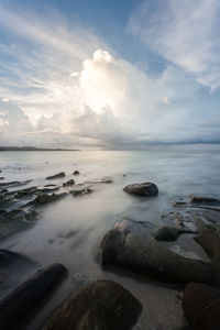 Clouds and surf. long exposure capture of coast and ocean on borneo, sabah - malaysia

