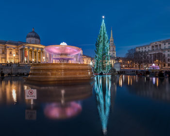 Reflection of illuminated buildings in water