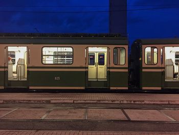 Train at railroad station against sky