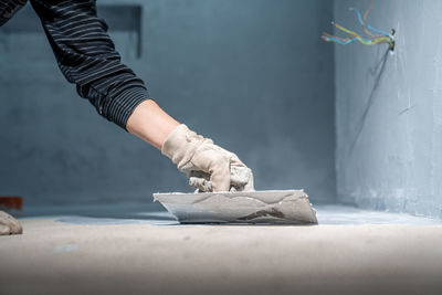 Cropped hand of person preparing food