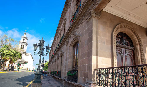 Exterior of historic building against sky in city