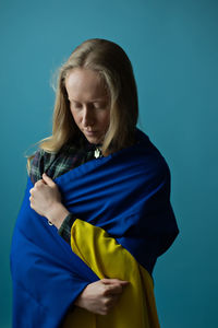 Young woman with ukrainian flag