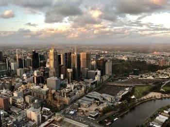 High angle view of modern buildings in city against sky