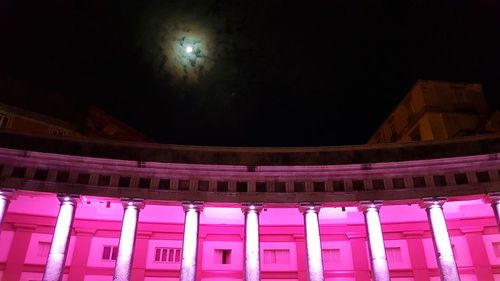 Low angle view of illuminated building at night