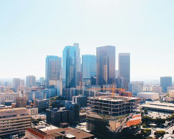 Modern cityscape against clear sky