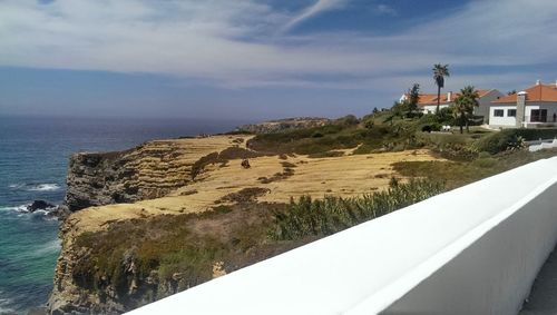 Scenic view of sea against cloudy sky