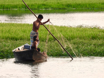Fisherman fishing in river 