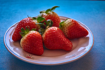 Close-up of strawberries in plate on table