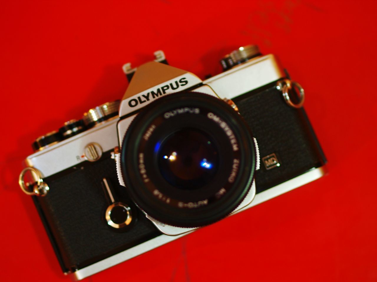 CLOSE-UP OF CAMERA ON MIRROR