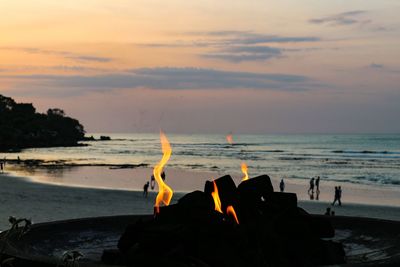 Scenic view of sea against sky at sunset