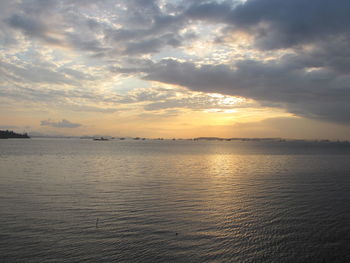 Scenic view of sea against cloudy sky