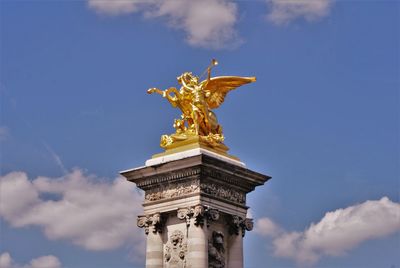 Golden sculpture on the pont alexandre iii