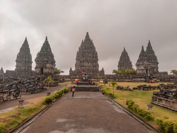 Historic temple against buildings