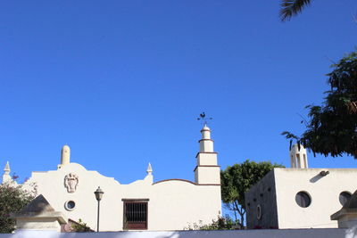 Low angle view of built structure against clear blue sky