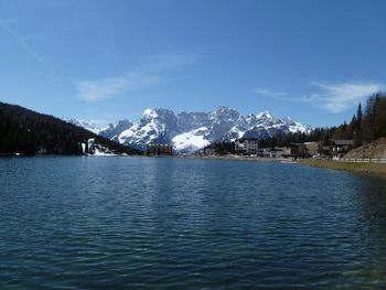 Scenic view of lake against cloudy sky