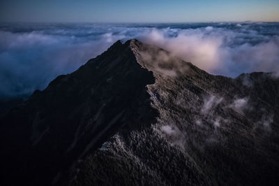 Scenic view of volcanic mountain against sky