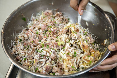 High angle view of person preparing food in bowl