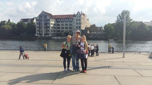 People at town square against sky