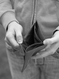 Man showing empty wallet