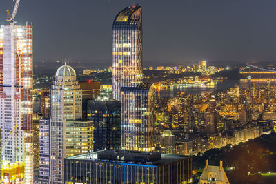 Illuminated buildings in city at night