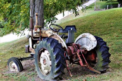 Abandoned tractor on field