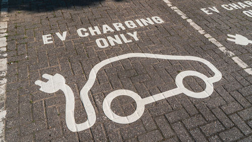 Ev charging symbol on car park space