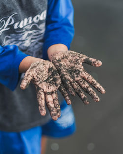 Close-up of boy with messy hands