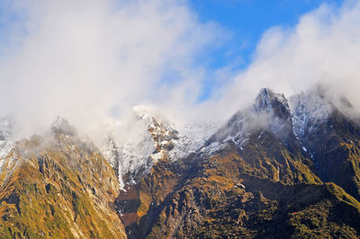 Scenic view of mountains against sky during winter