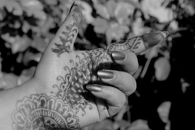 Close-up of woman hand holding umbrella