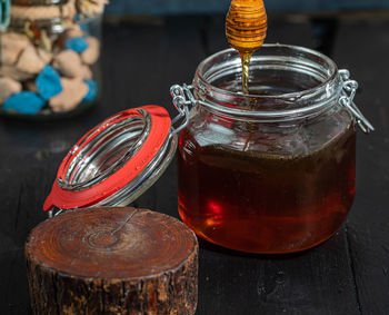 Close-up of glass jar on table at market stall