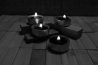 High angle view of tea light candles on table