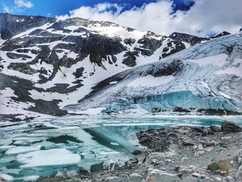 Scenic view of snowcapped mountains against sky