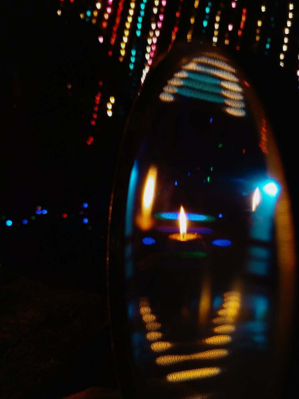 DEFOCUSED IMAGE OF ILLUMINATED STREET AT NIGHT