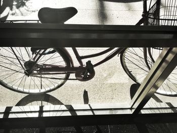 Bicycle parked against large wall