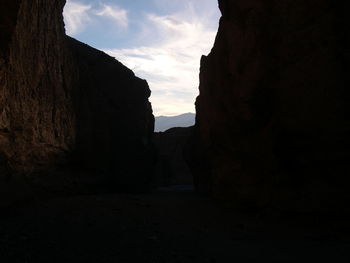 View of cliff against cloudy sky