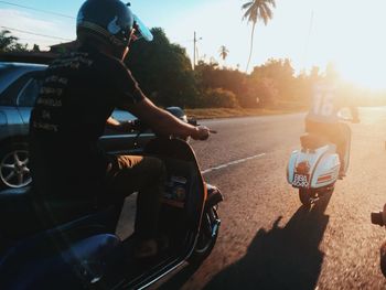 Man riding motorcycle on road