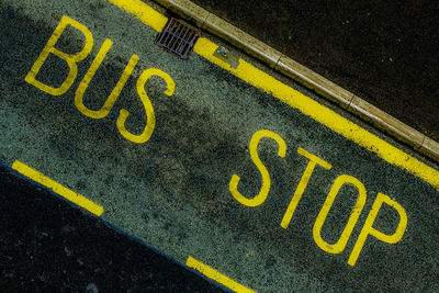 High angle view of yellow text on street