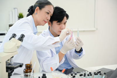 Doctor examining chemical in laboratory