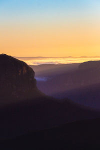 Scenic view of silhouette mountain against sky during sunset