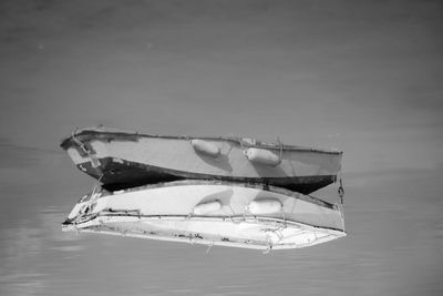 Close-up of boat on table by sea