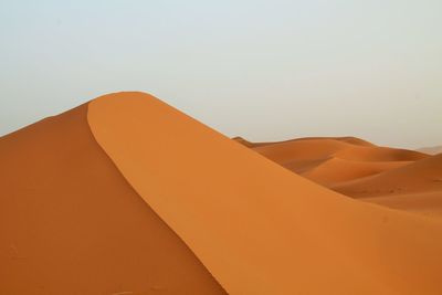 Scenic view of desert against clear sky