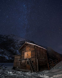 Hut against starlit sky