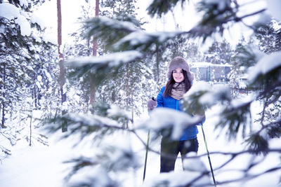 Full length of woman on snow covered land