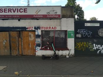 Information sign on footpath by street