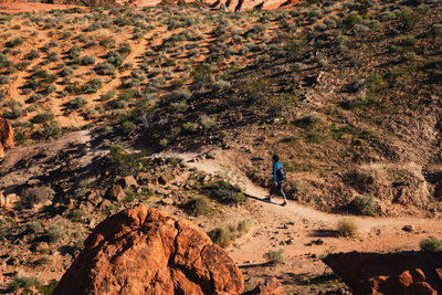 Female hiker walking through the landscape