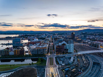 High angle view of illuminated cityscape against sky