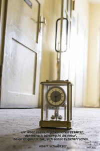 Close-up of clock on table