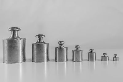 Close-up of bottles against white background