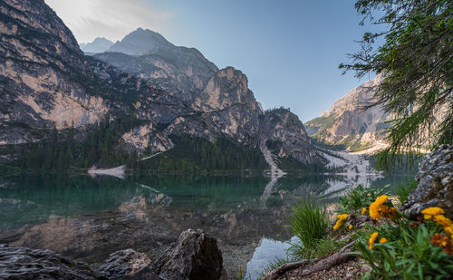 Scenic view of lake and mountains against sky